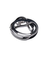 Black leather wrap bracelet featuring a double wrap with a silver snake chain, a magnetic closure, and a malleable bangle.