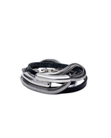 Black leather wrap bracelet featuring a silver-plated snake chain. Malleable bangle interwoven with adjustable closures.