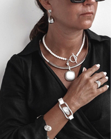 Three-piece silver lava leather jewelry set featuring a lava stone choker, a silver-plated statement necklace, and an adjustable bracelet.
