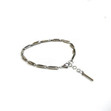 Silver stainless steel anklet with elongated links and a minimalist bar charm for a layered, boho style.