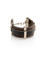 Brown leather bracelet with silver accents on a white background