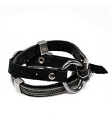 Black leather bracelet with metal accents on a white background