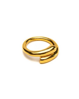 A polished gold-toned wrap ring with a modern, open wrap design, photographed on a seamless white background.