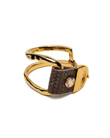 Gold ring with a textured brown band on a white background