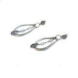 Pair of silver earrings on a white background
