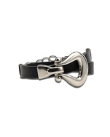 Black leather dog collar with a silver metal clasp on a white background