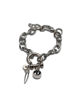 Silver chain bracelet with unique charms on a white background