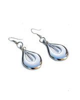 Pair of silver teardrop earrings on a white background