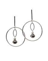 Elegant silver loop earrings featuring Austrian crystal pendants, showcasing a chic dangle design.