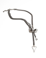 Silver necklace with a heart-shaped pendant on a white background
