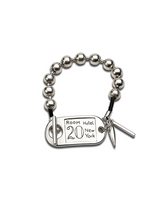 Chunky silver ball chain bracelet featuring an ID tag closure, with a unique rock style and leather accents.