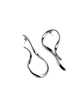Pair of silver earrings on a white background