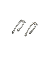 Minimal chic silver geometric droplet earrings with an irregular shape, lightweight design, and a sleek finish.