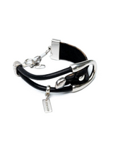 Black leather bracelet with silver accents on a white background