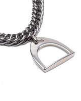 Metallic chain necklace with a heart-shaped pendant on a white background