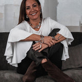 Chunky silver-plated anchor link necklace and bracelet set worn by a woman in a white top, showcasing an edgy boho style.
