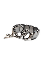 Metallic bracelet with a clasp on a white background