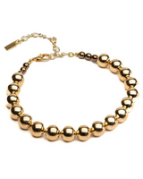 Gold beaded bracelet on a white background