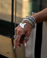 Multi-layered wrap bracelet with an oxidized silver Great White Shark tooth pendant, paired with heavy metal chains.
