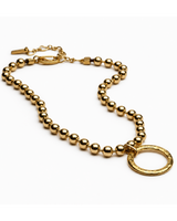 Gold beaded necklace with a clasp on a white background