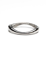 Chunky silver cuff bangle with a polished finish, featuring a sleek, minimalist design ideal for stacking.