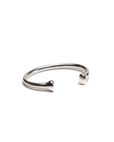 Unisex silver-plated open bangle bracelet with rounded ends, showcasing a sleek, modern design.