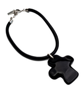 Large black asymmetric cross choker necklace with a chunky leather cord and oversized, abstract cross pendant.