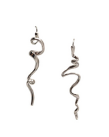 Abstract zinc drop earrings featuring an asymmetrical design with irregular twisted shapes in shiny silver, measuring 2.5 inches long.