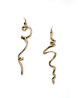 Abstract gold drop earrings featuring mismatched, irregular shapes with a 2.5-inch drop for dynamic movement.