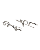 Abstract zinc drop earrings feature a lightweight silver design with mismatched, irregular shapes and a 2.5-inch drop.
