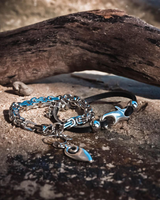 Chunky shark leather chain anklet features black leather, sterling silver-plated shark charm, and extension chain.