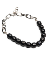 Black leather choker with chunky hematite beads and silver chain links, featuring a textured design for a bold look.