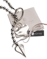 Long chunky heart ball chain necklace featuring oversized metallic heart charms on a silver ball chain, elegantly displayed.
