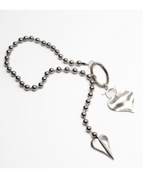 Long chunky heart ball chain necklace featuring oversized metal ball chain with sculpted heart charms, silver finish.