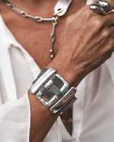 Chunky statement bracelet with oversized zamak slider bars and flat brass chain, finished in antique silver plating.