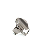 Adjustable sterling silver ring featuring a large, irregular abstract circle design with a shiny finish.