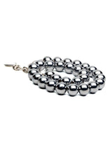 Unisex hematite beaded wrap bracelet with 12mm dark gray beads and sleek silver accents, ideal for stacking.