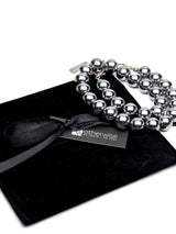 Hematite beaded wrap bracelet with silver accents, featuring chunky dark gray beads and a stackable design.