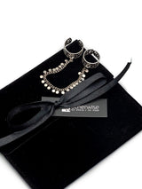Connected Chevalier Ring Set showcasing two brass rings linked by an antique silver chain, presented on a black velvet pouch.