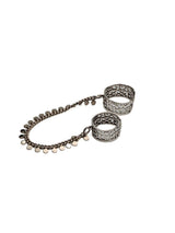 Connected Chevalier Ring Set featuring two wide brass bands linked by an antique silver chain with round charms.