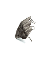 Chunky irregular knuckle ring in textured, sculptural zinc alloy with raised folds, showcasing a modern avant-garde design.