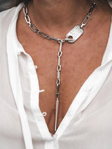 Personalized stainless steel lariat necklace with a silver link chain and engraved ID tag, worn in a Y-drop style.