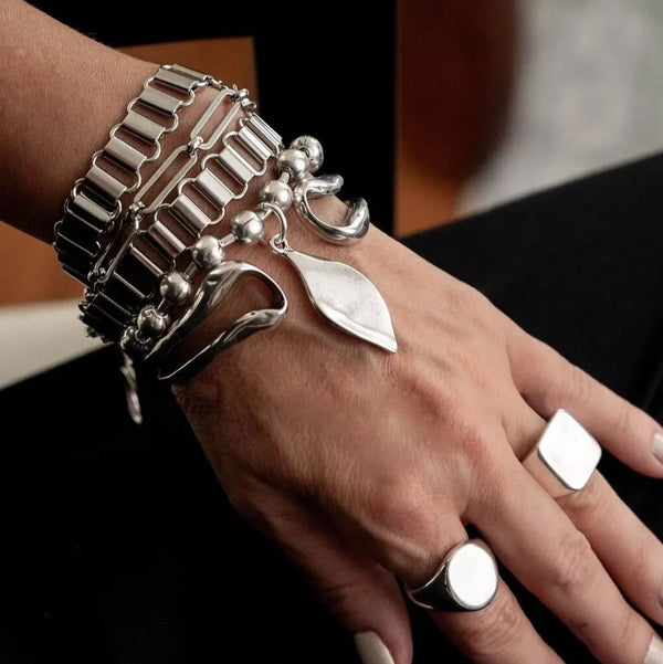 Layered statement chain bracelets and bangle, Stacked chunky stainless steel bracelets and hammered bangle.